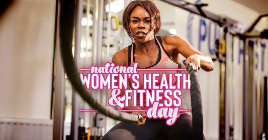 National women's health & fitness day - woman working out with battle rope 