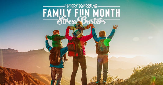 Family finished hike on top of a mountain - Hungry Squirrel family fun month stress busters