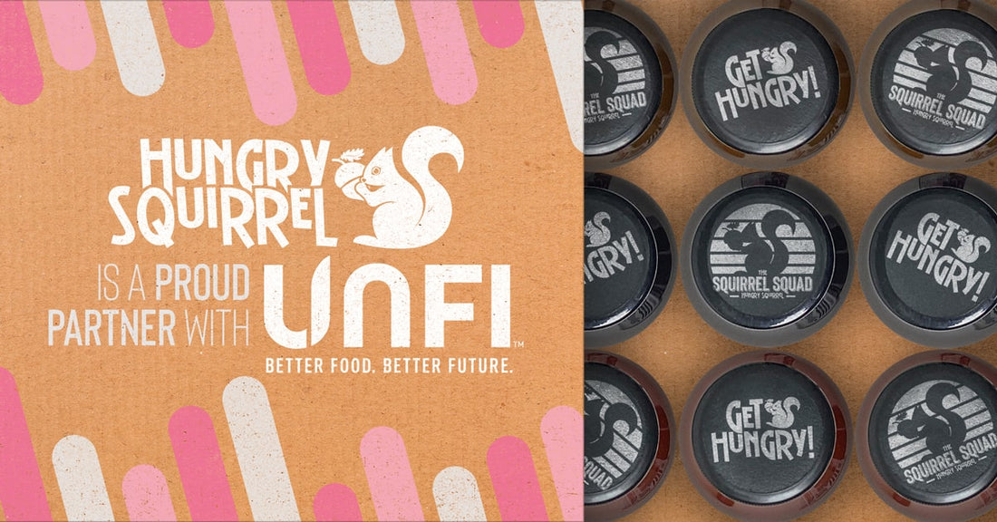 Bird's-eye view of Hungry Squirrel's sauce bottles with accompanying text that proudly declares their partnership with UNFI.
