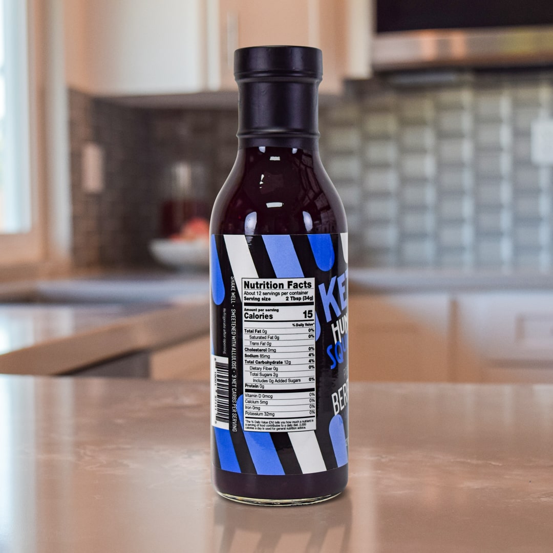Triple Berry Sauce Product on top a kitchen counter  - Back of Bottle - for nutritional info please read below product description